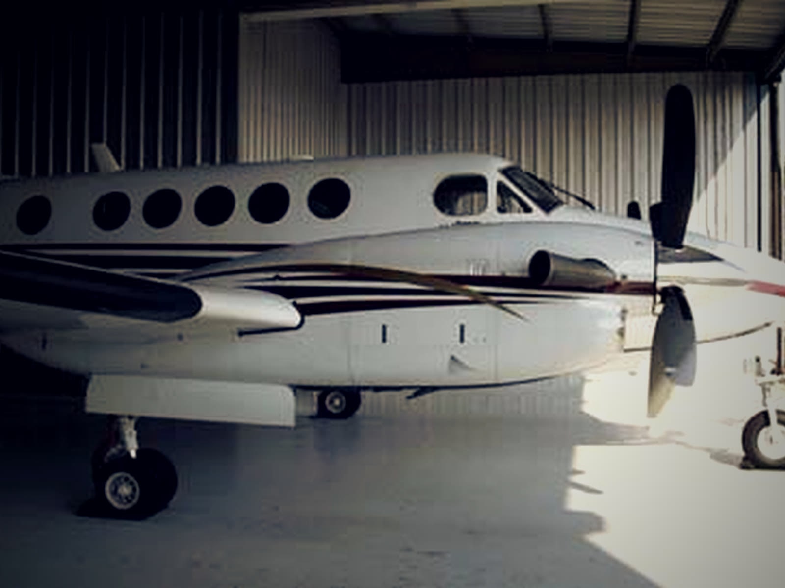 A Beechcraft King Air inside the Foothills Aviation shop at KTOC.